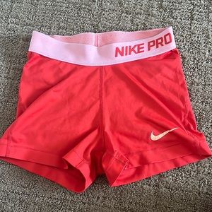 Nike orange athletic shorts size xs.